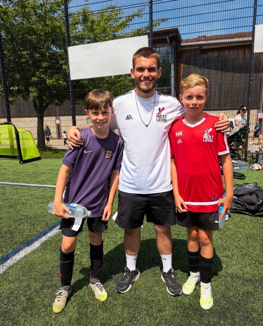 Next Level coach with players after a session